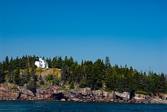 Bear Island Light on a Hilltop Amongst Evergreen Trees